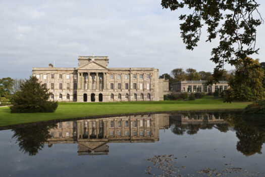 The south front of Lyme Park, seen across the lake