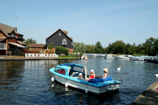 Family boating on Wroxham Broads